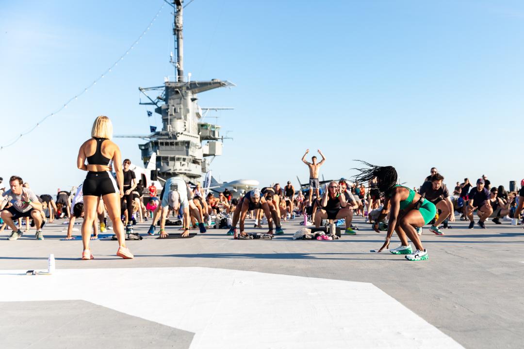 People working out on the flight deck of the USS Yorktown.
