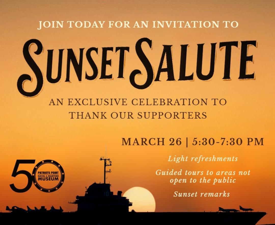 Aircraft carrier with sun setting in the background.