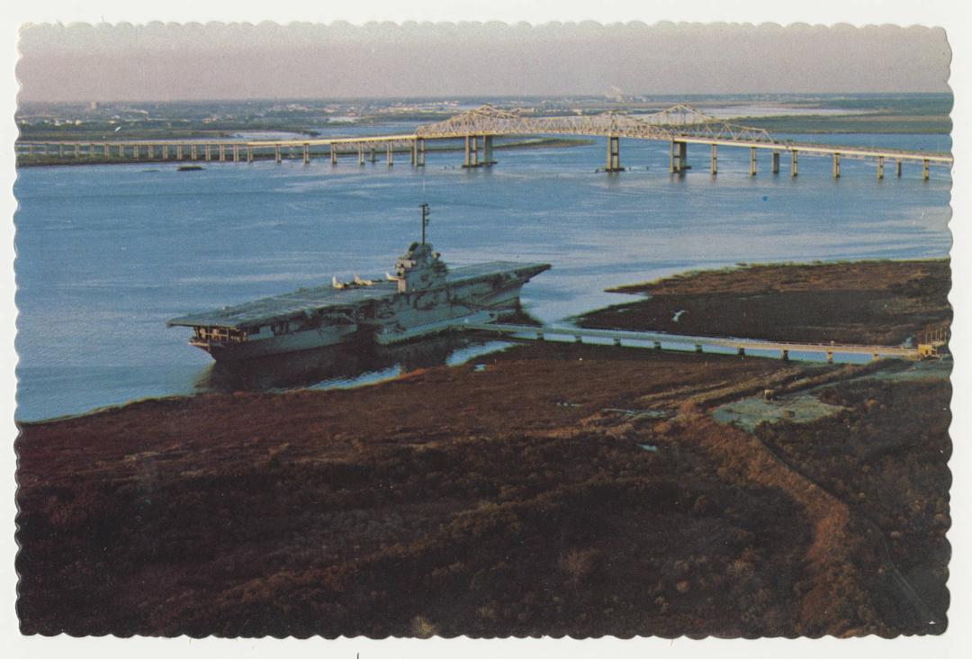 Vintage postcard image of the USS Yorktown in Charleston Harbor.