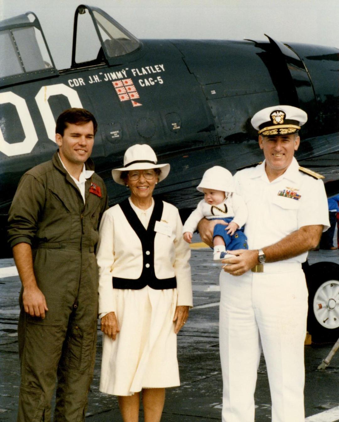 Admiral Flatley and his family posed in front of an aircraft