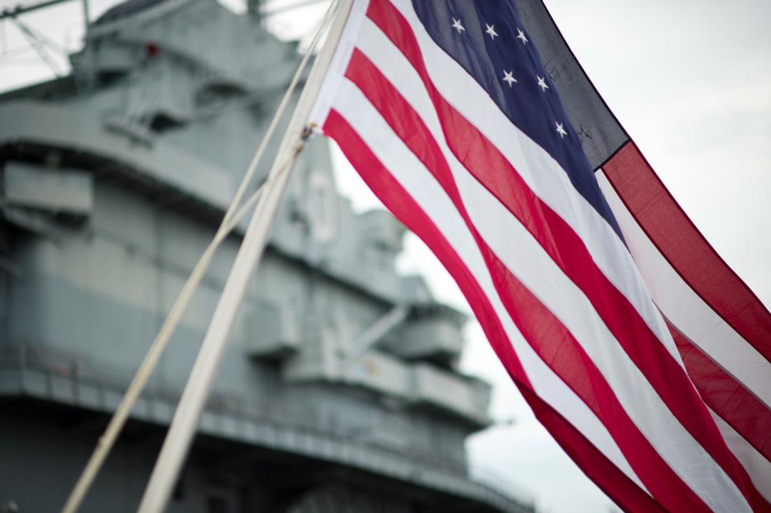 American Flag waving in front of Patriots Point